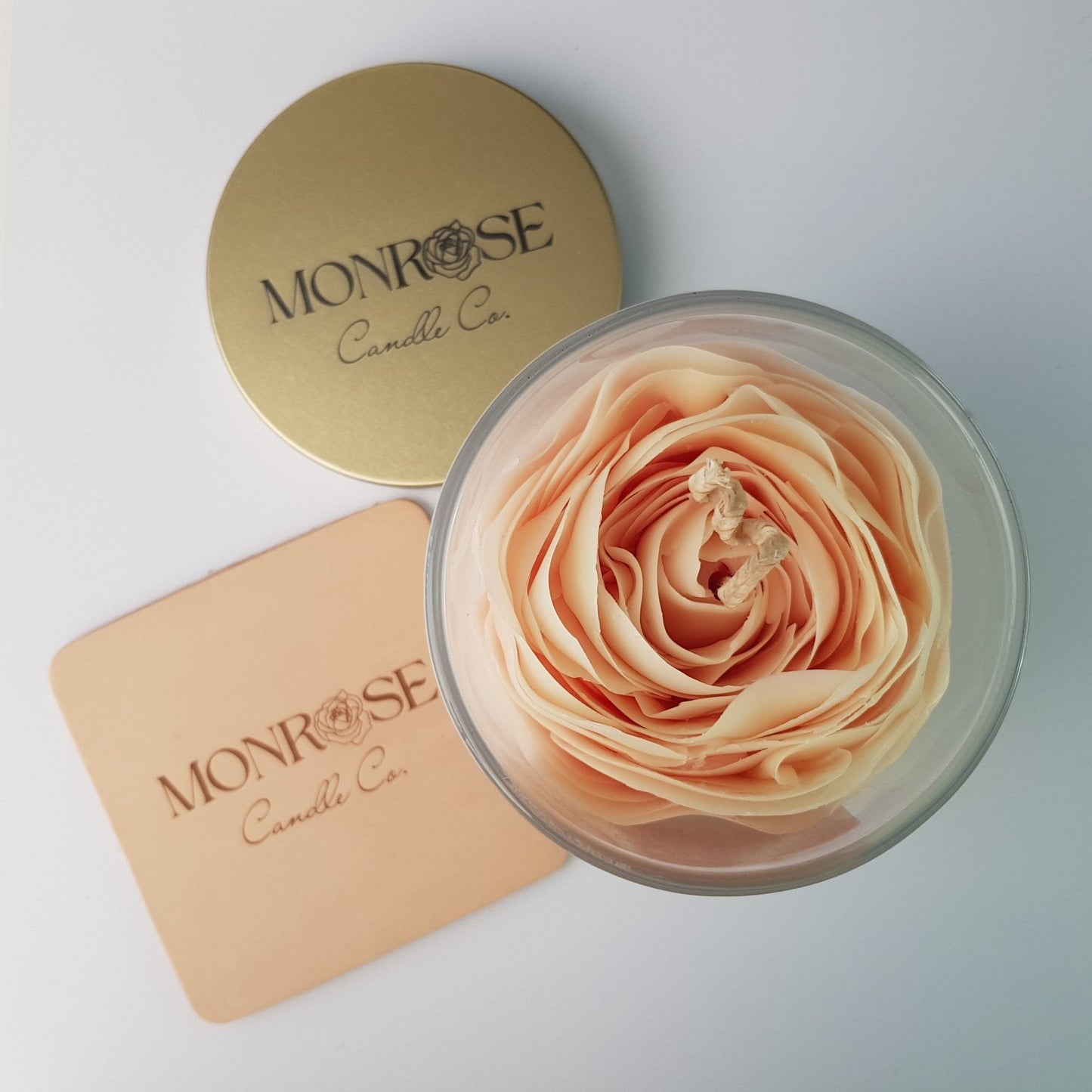 Top view of a Rose Candle No.1 in a clear jar with "Lychee Peony" fragrance and a cotton wick, containing 365 grams of bees & soy wax and offering 56 hours of burn time.