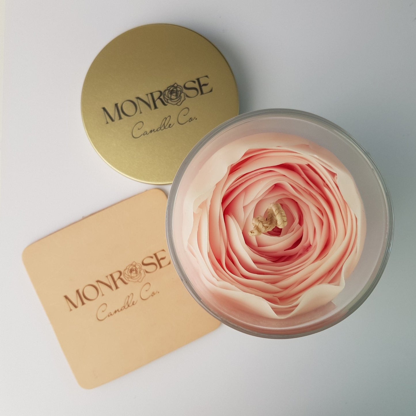 Top view of a Rose Candle as No.2 in a clear jar with "Lychee Peony" fragrance and a cotton wick, containing 365 grams of bees & soy wax and offering 56 hours of burn time.