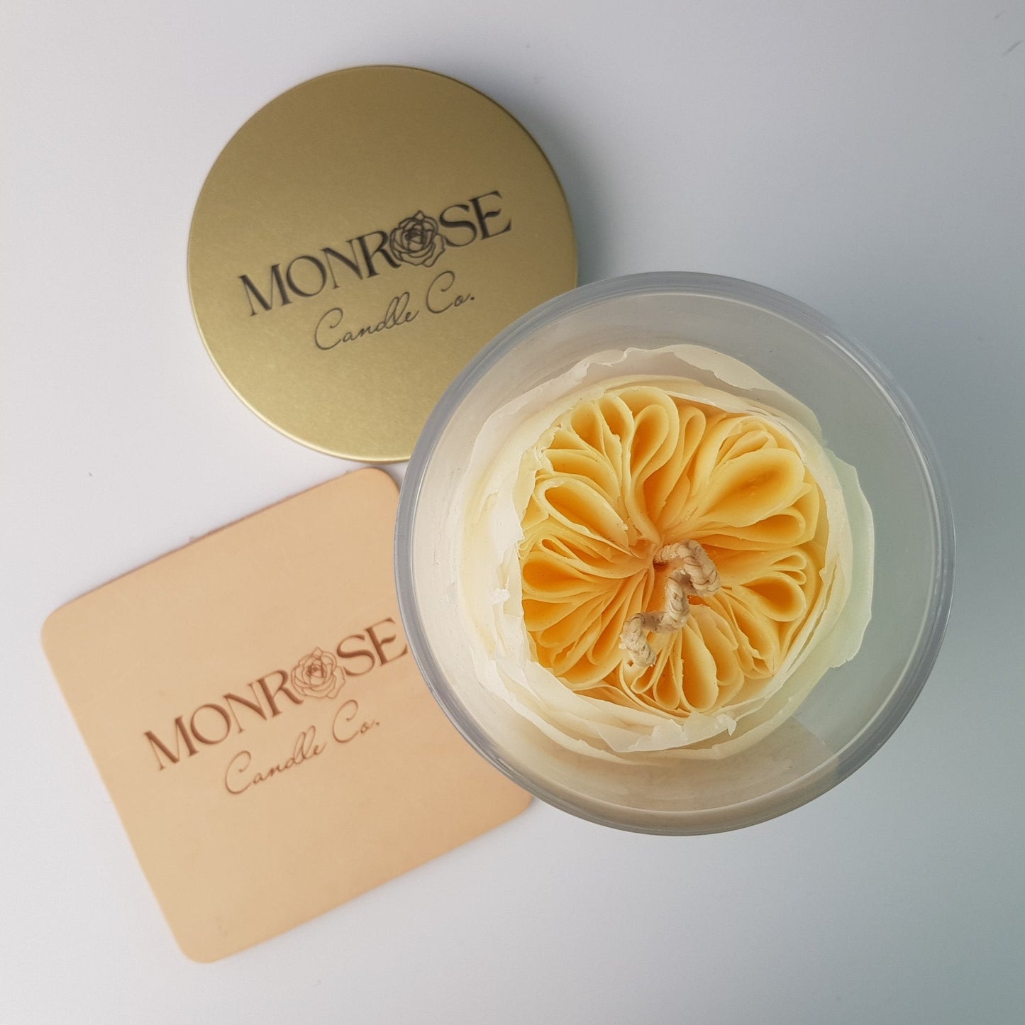 Top view of a Rose Candle as No.6 in a clear jar with "Miss Dior" fragrance and a cotton wick, containing 365 grams of bees & soy wax and offering 56 hours of burn time.