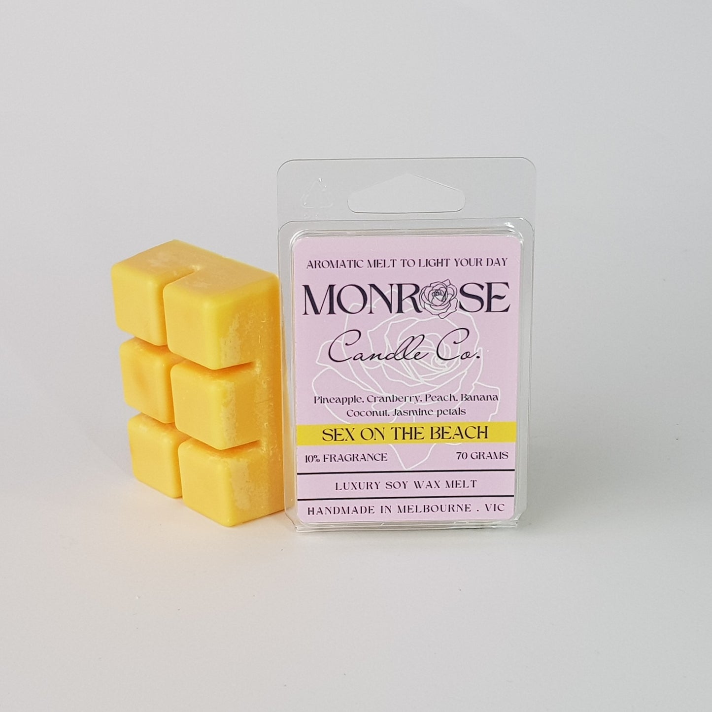 This is the side view of a 6 pack soy wax melt, featuring a yellow solid wax melt standing on the left of the packaging. The fragrance of the wax melt is "Sex on the beach" and contains 70 grams of soy wax and it is hand crafted in Melbourne, Australia.