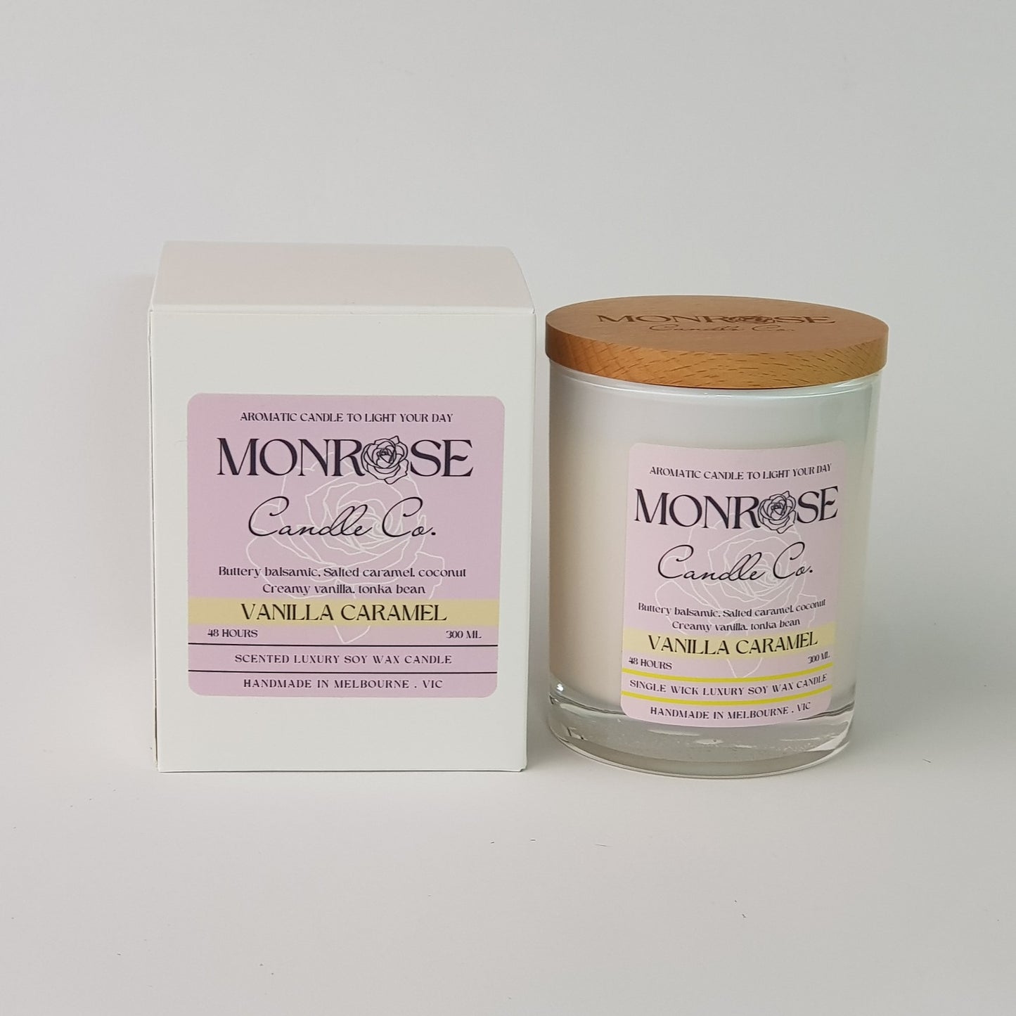 Front view of a white jar candle with 'vanilla caramel" fragrance and a cotton wick, containing 265 grams of soy wax and offering 48 hours of burn time.