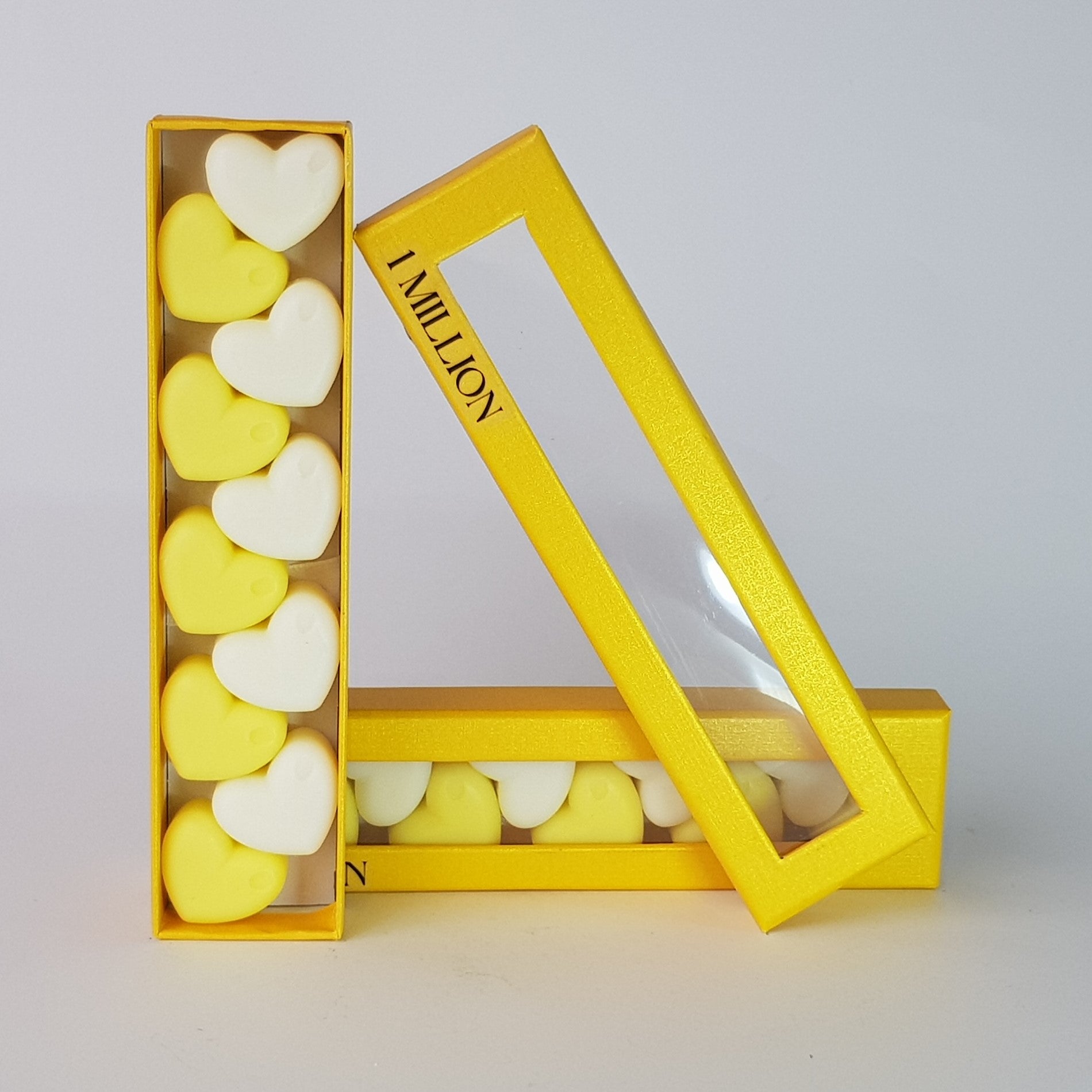 "This is the front view of heart shaped soy wax melts, featuring 10 solid wax melts inside a rectangular box. The fragrance of the wax melt is  "1 million" and it contains 76 grams of soy wax and it is hand crafted in Melbourne, Australia."