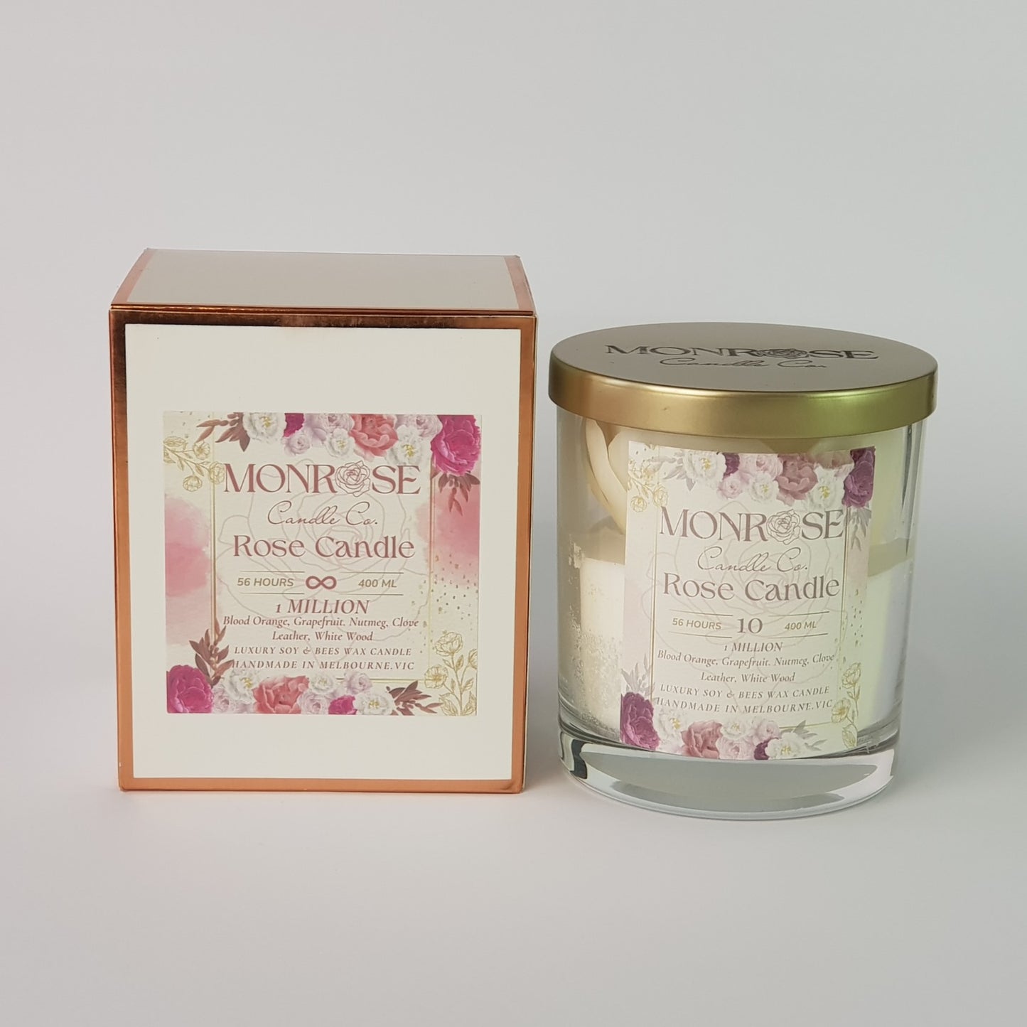 "Front view of a Rose candle in clear glass jar with "1 million fragrance" and a cotton wick, containing 360 grams of bees & soy wax and offering 56 hours of burn time."