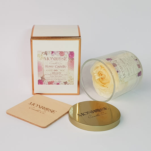 "Side view of a Rose candle in clear glass jar with "1 million" fragrance and a cotton wick, containing 260 grams of bees & soy wax and offering 48 hours of burn time."