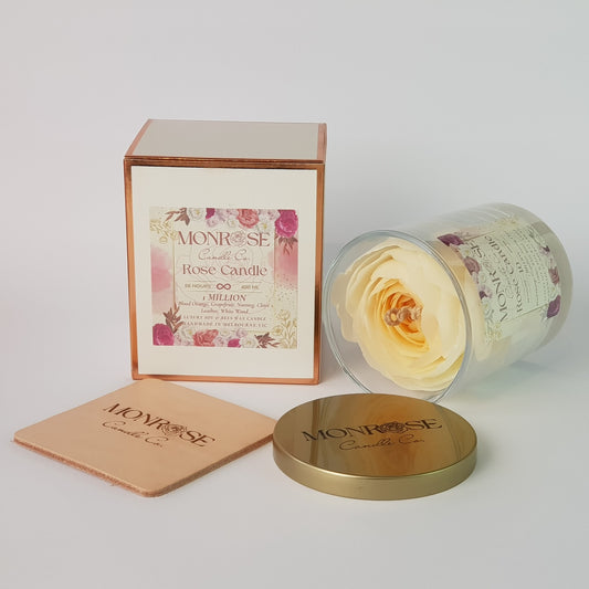 "Side view of a Rose candle in clear glass jar with "1 million fragrance" and a cotton wick, containing 360 grams of bees & soy wax and offering 56 hours of burn time."