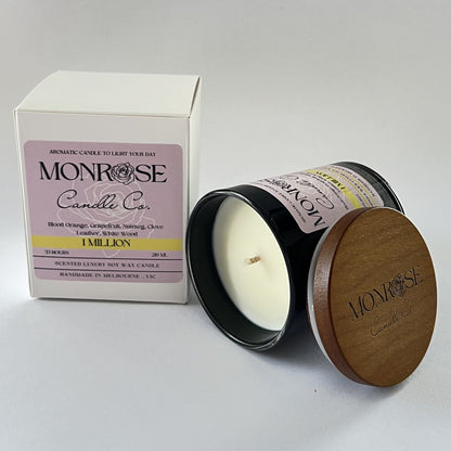 "Side view of a black jar candle with 1 million fragrance and a cotton wick, containing 185 grams of soy wax and offering 33 hours of burn time."