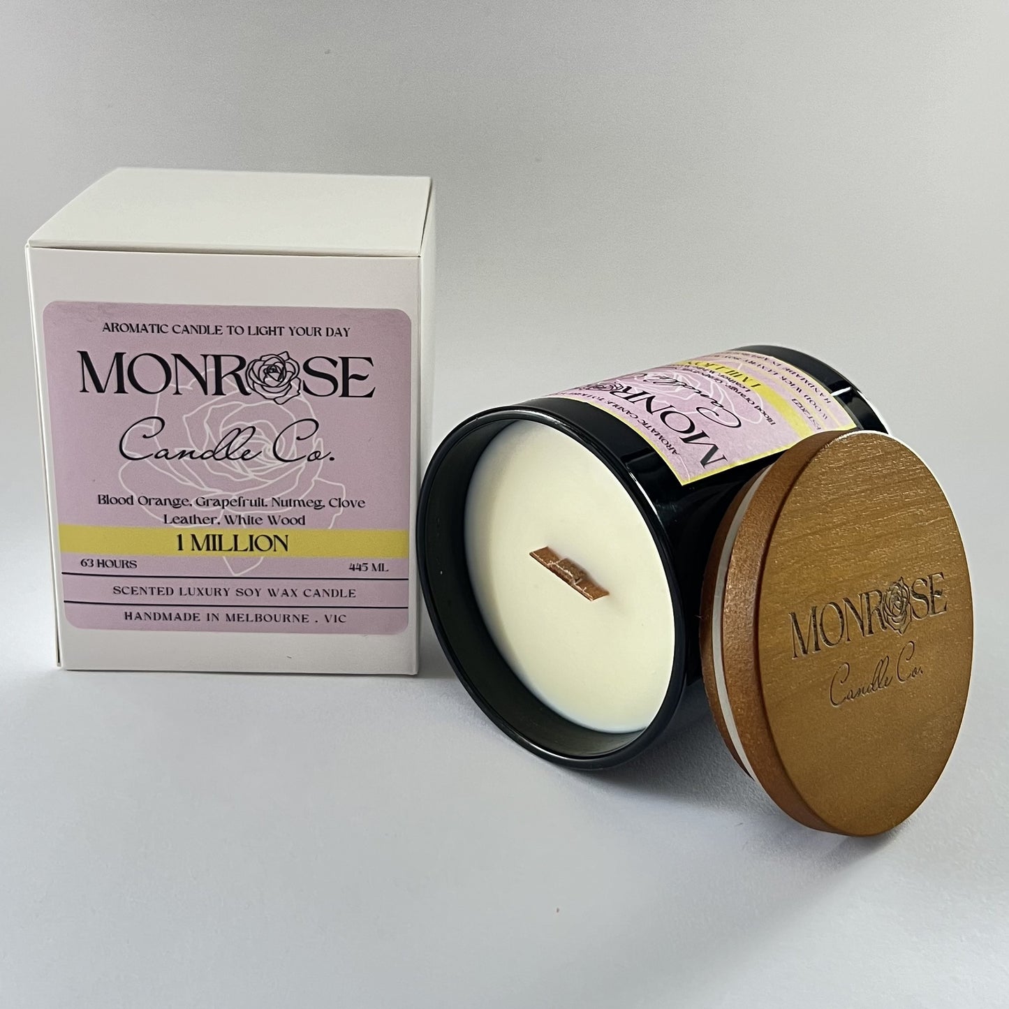 "Side view of a black jar candle with 1 million fragrance and wood cotton wick, containing 395 grams of soy wax and offering 63 hours of burn time."