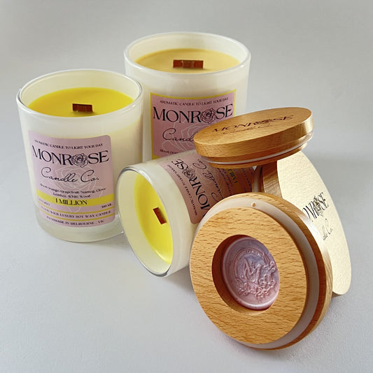 Front view of candle collection with "1 Million" fragrance in White jars and  wood wicks.