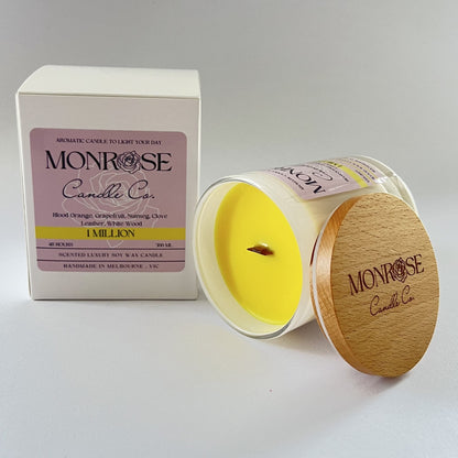 Side view of a white jar candle with "1 million" fragrance and wood wick, containing 265 grams of soy wax and offering 48 hours of burn time.
