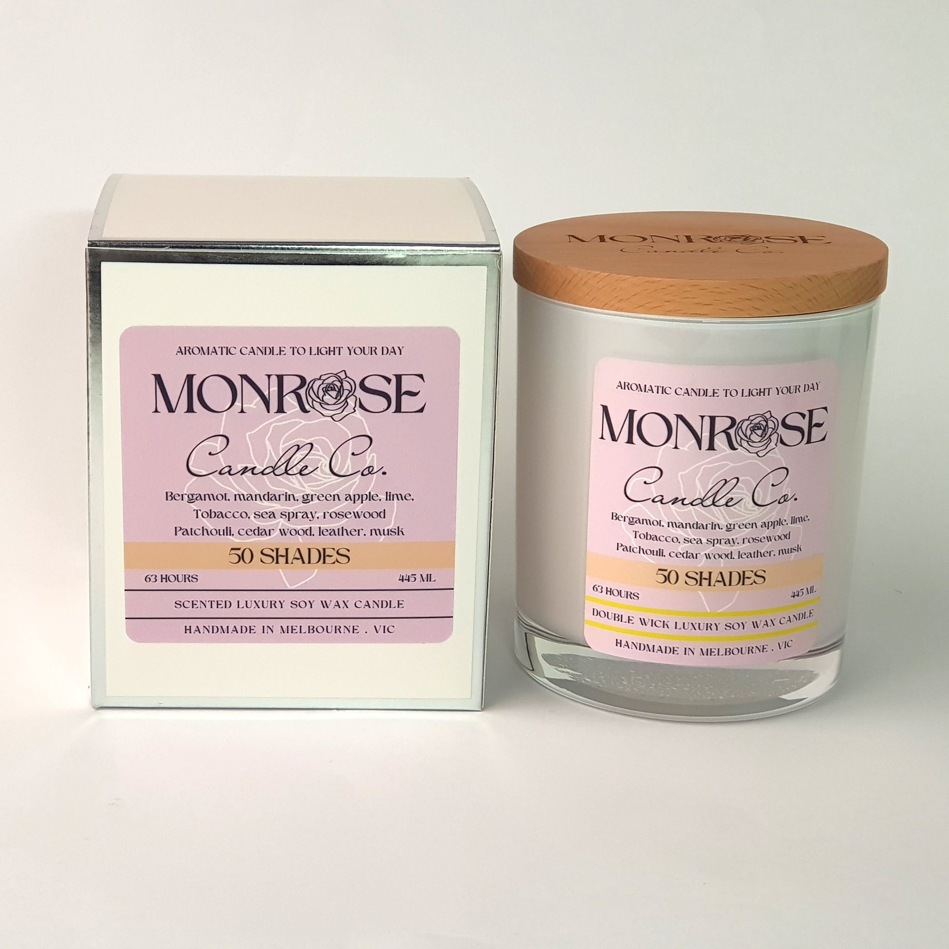 Front view of a white jar candle with "50 Shades" fragrance and a cotton wick, containing 395 grams of soy wax and offering 63 hours of burn time.