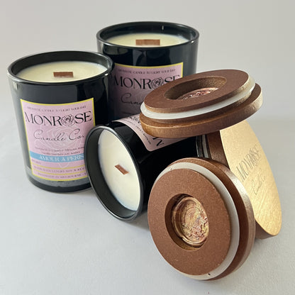 Front view of black jar candle collection with "Amour a Paris" fragrance and wood wick.