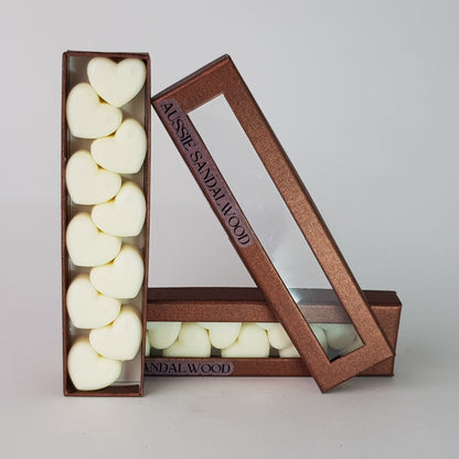This is the front view of heart shaped soy wax melts, featuring 10 solid wax melts inside a rectangular box. The fragrance of the wax melt is  "Australian sandalwood" and it contains 76 grams of soy wax and it is hand crafted in Melbourne, Australia.