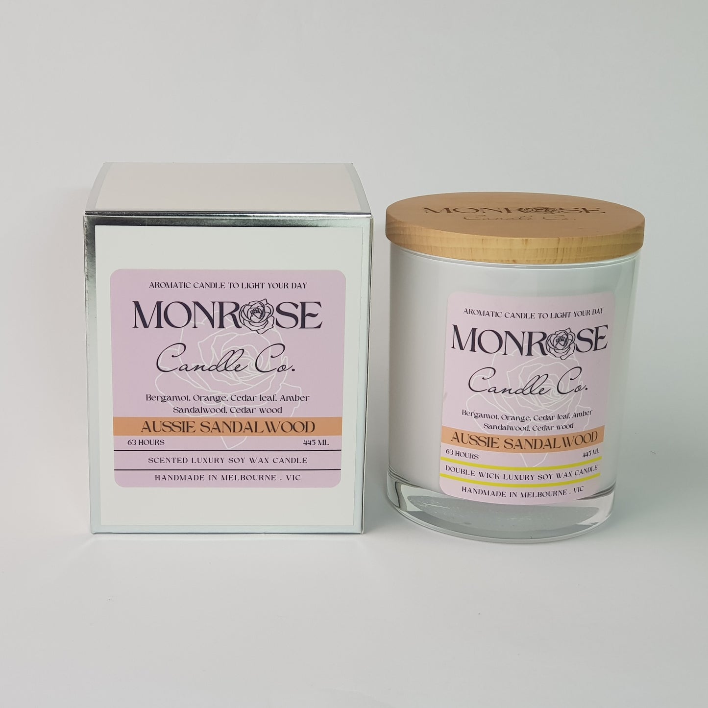 Front view of a container candle with "Australian Sandalwood" fragrance in white glass jar and a cotton wick, containing 395 grams of soy wax and offering 63 hours of burn time.