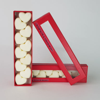 This is the front view of heart shaped soy wax melts, featuring 10 solid wax melts inside a rectangular box. The fragrance of the wax melt is  "Champagne and strawberry" and it contains 76 grams of soy wax and it is hand crafted in Melbourne, Australia.