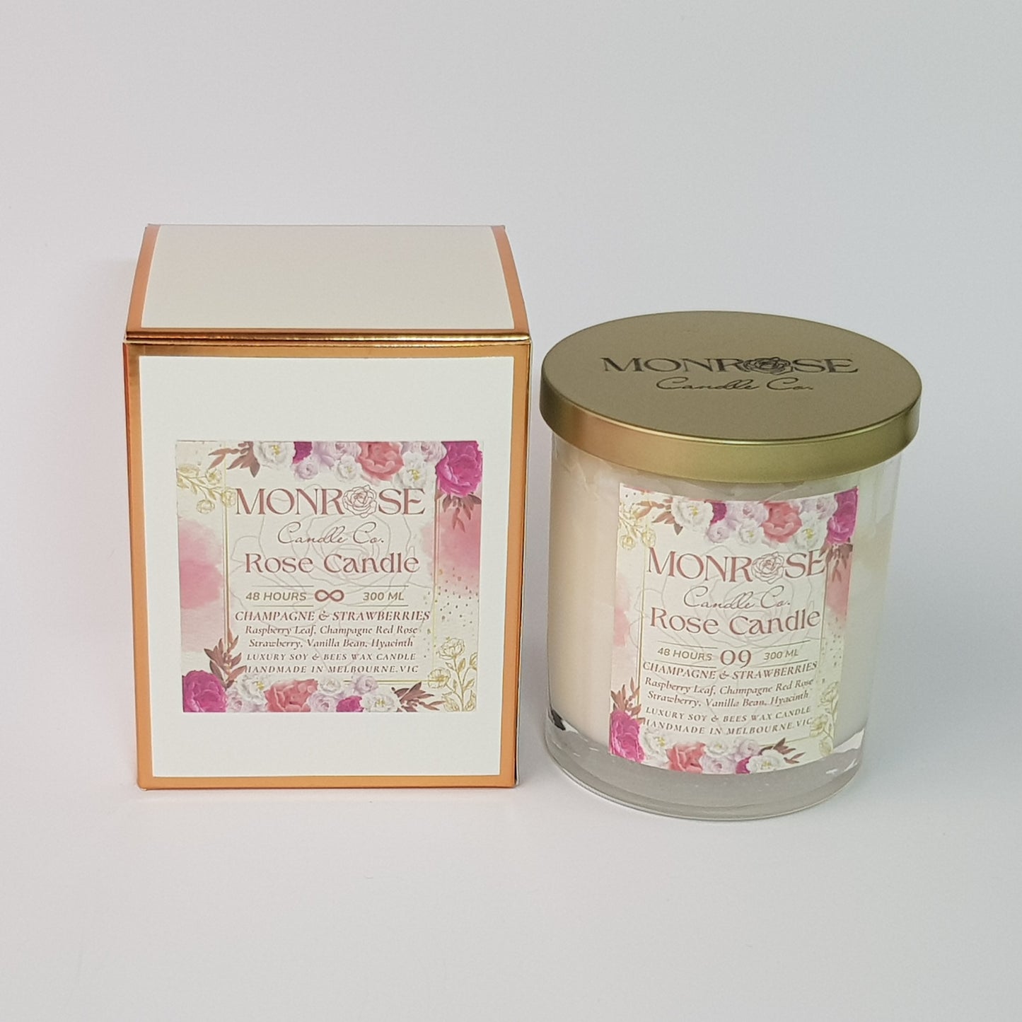 Front view of a Rose Candle No.9 in a clear jar with "Champagne & strawberries" fragrance and cotton wick, containing 365 grams of soy wax and offering 56 hours of burn time.
