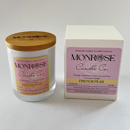 Side view of a white jar candle with "French pear" fragrance and double cotton wicks, containing 395 grams of soy wax and offering 63 hours of burn time.