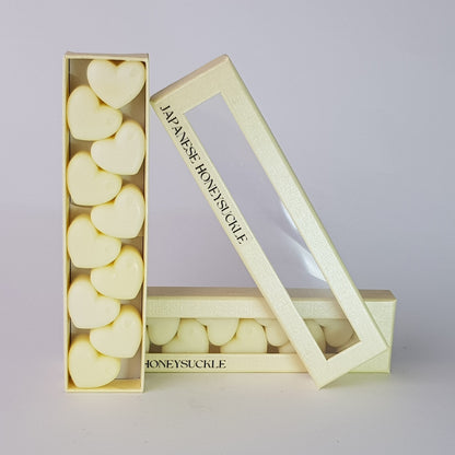 "This is the front view of heart shaped soy wax melts, featuring 10 solid wax melts inside a rectangular box. The fragrance of the wax melt is  "Japanese honeysuckle" and it contains 76 grams of soy wax and it is hand crafted in Melbourne, Australia."