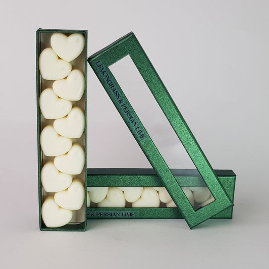 This is the front view of heart shaped soy wax melts, featuring 10 solid wax melts inside a rectangular box. The fragrance of the wax melt is  "Lemongrass and persian lime" and it contains 76 grams of soy wax and it is hand crafted in Melbourne, Australia.