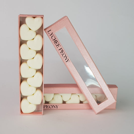 "This is the front view of heart shaped soy wax melts, featuring 10 solid wax melts inside a rectangular box. The fragrance of the wax melt is  "Lychee peony" and it contains 76 grams of soy wax and it is hand crafted in Melbourne, Australia."