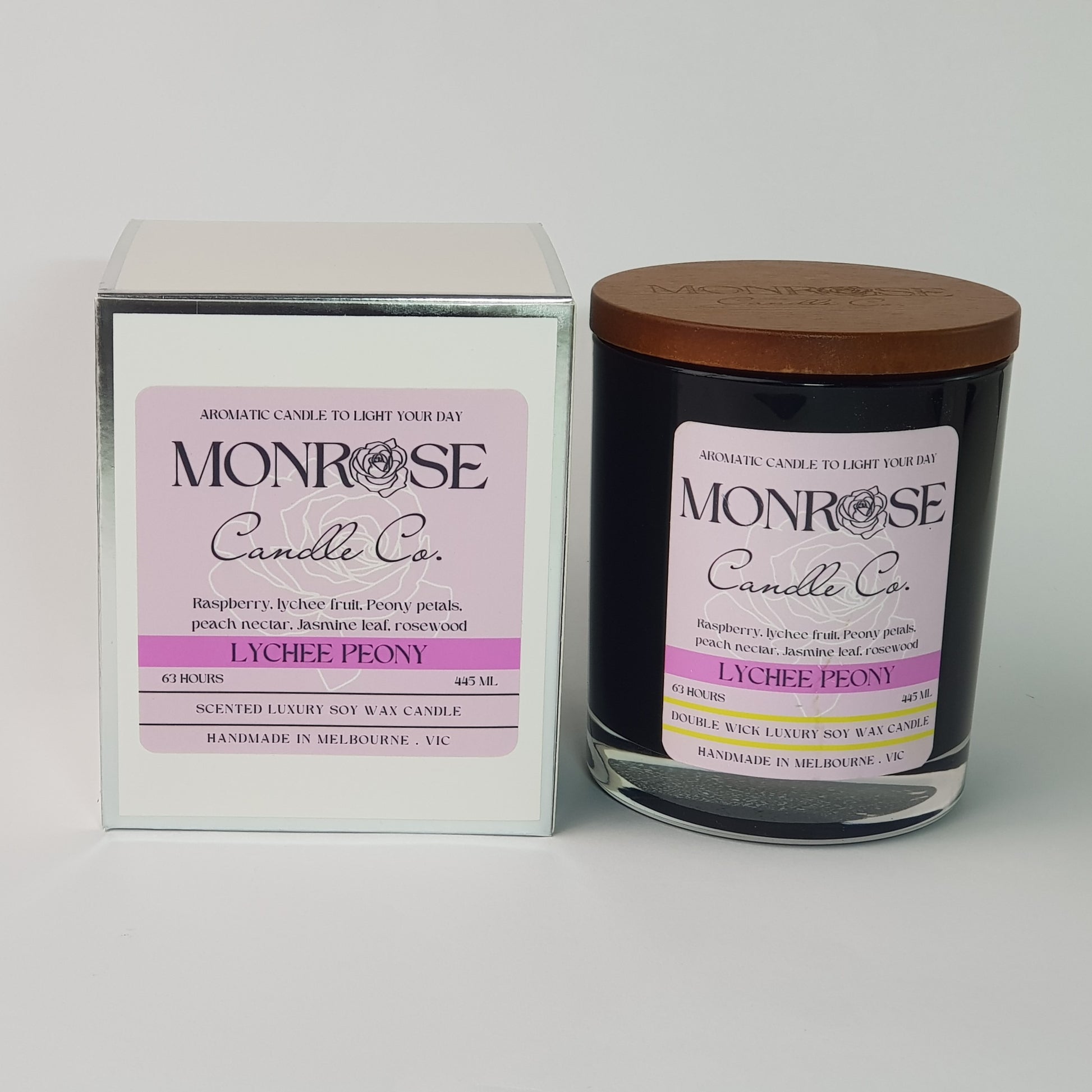 Front view of a black jar candle with "Lychee peony" fragrance and double cotton wicks, containing 395 grams of soy wax and offering 63 hours of burn time.