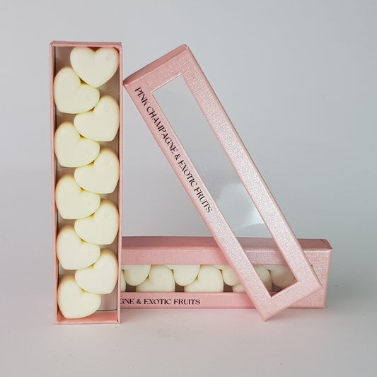 This is the front view of heart shaped soy wax melts, featuring 10 solid wax melts inside a rectangular box. The fragrance of the wax melt is  "Pink champagne and exotic fruits" and it contains 76 grams of soy wax and it is hand crafted in Melbourne, Australia.