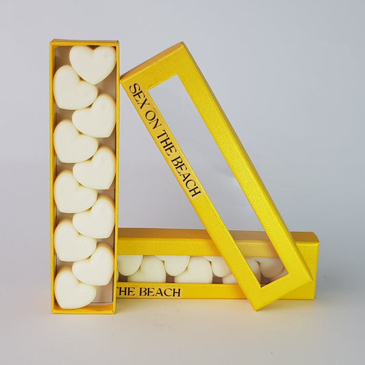 This is the front view of heart shaped soy wax melts, featuring 10 solid wax melts inside a rectangular box. The fragrance of the wax melt is  "Sex on the beach" and it contains 76 grams of soy wax and it is hand crafted in Melbourne, Australia.