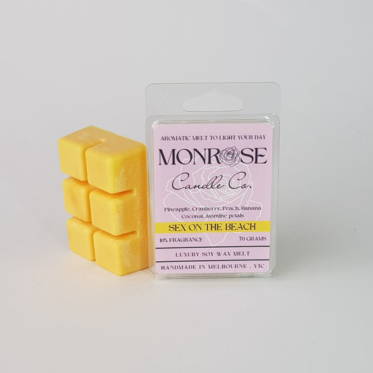 This is the side view of a 6 pack soy wax melt, featuring a yellow solid wax melt standing on the left of the packaging. The fragrance of the wax melt is "Sex on the beach" and contains 70 grams of soy wax and it is hand crafted in Melbourne, Australia.