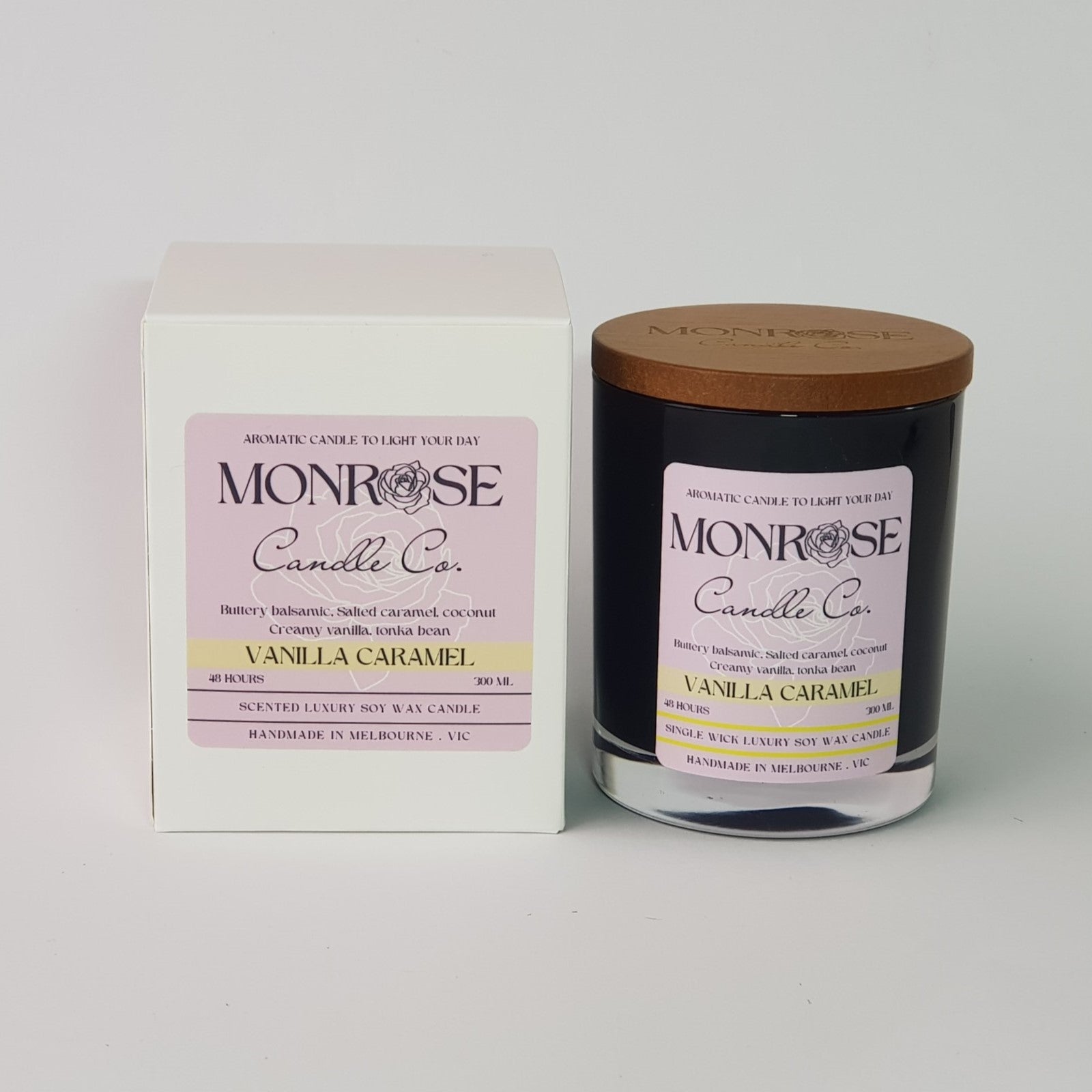 Front view of a black jar candle with "vanilla caramel" fragrance and a cotton wick, containing 265 grams of soy wax and offering 48 hours of burn time.