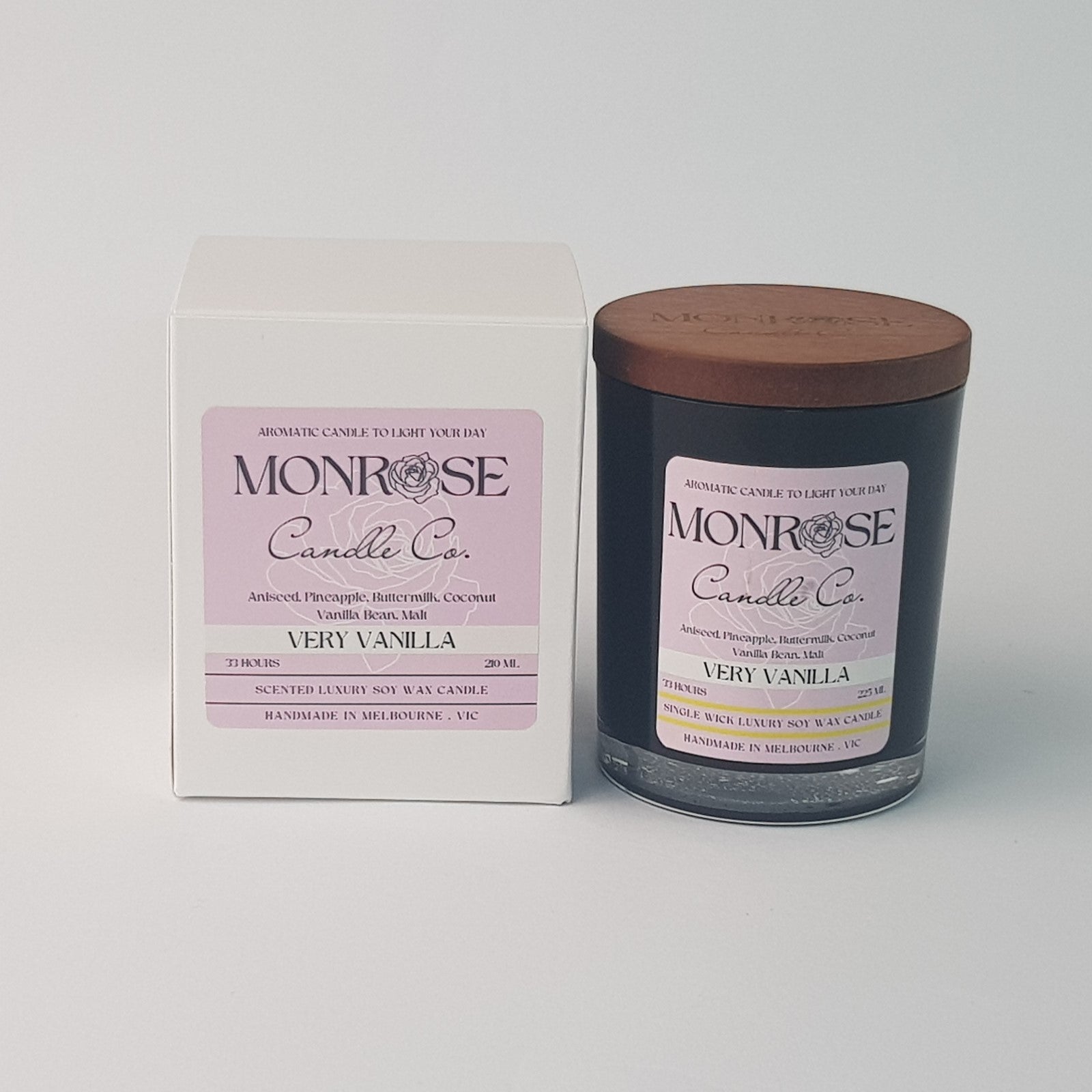 Front view of a black jar candle with "very vanilla" fragrance and a cotton wick, containing 185 grams of soy wax and offering 33 hours of burn time.