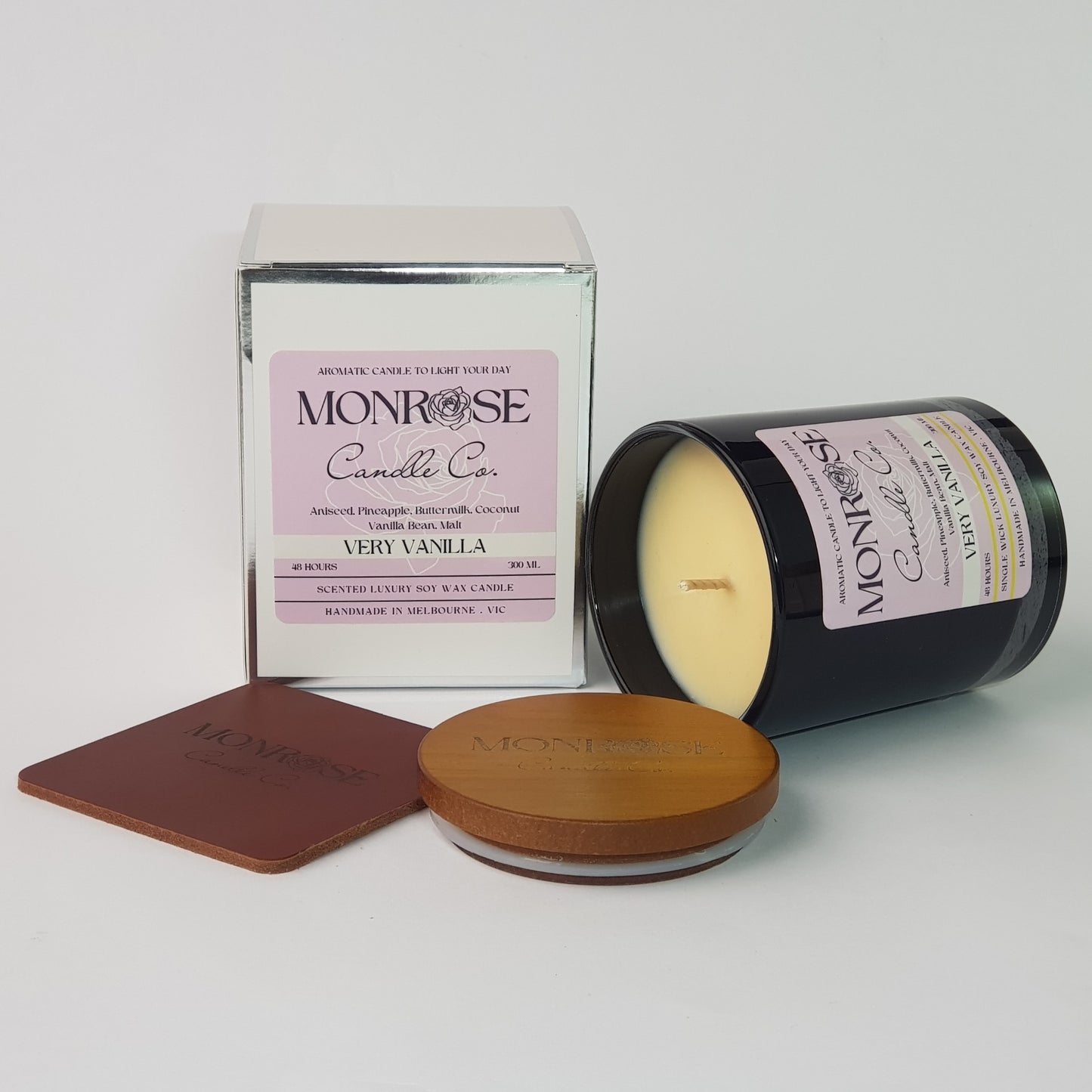 Side view of a black jar candle with the "very vanilla" fragrance and a cotton wick, containing 265 grams of soy wax and offering 48 hours of burn time.