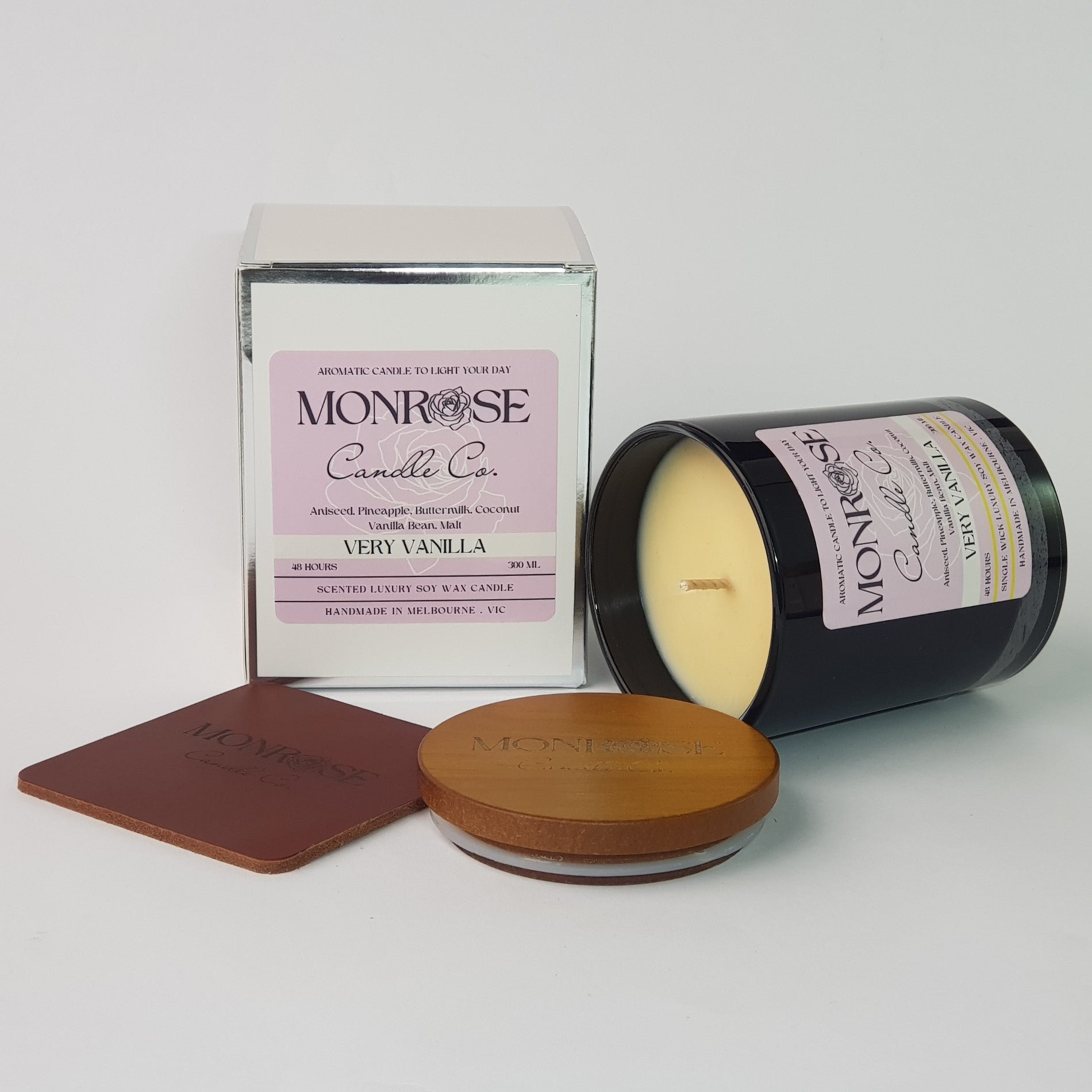 Side view of a black jar candle with the "very vanilla" fragrance and a cotton wick, containing 265 grams of soy wax and offering 48 hours of burn time.
