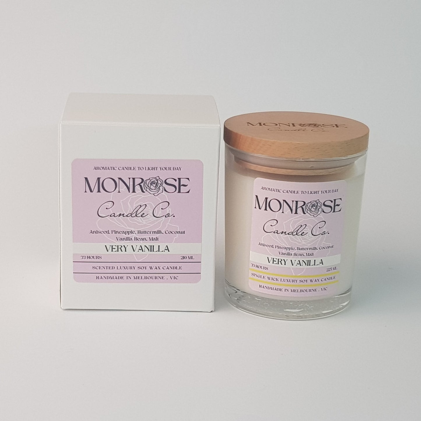 Front view of a clear jar candle with "very vanilla" fragrance and a cotton wick, containing 185 grams of soy wax and offering 33 hours of burn time.