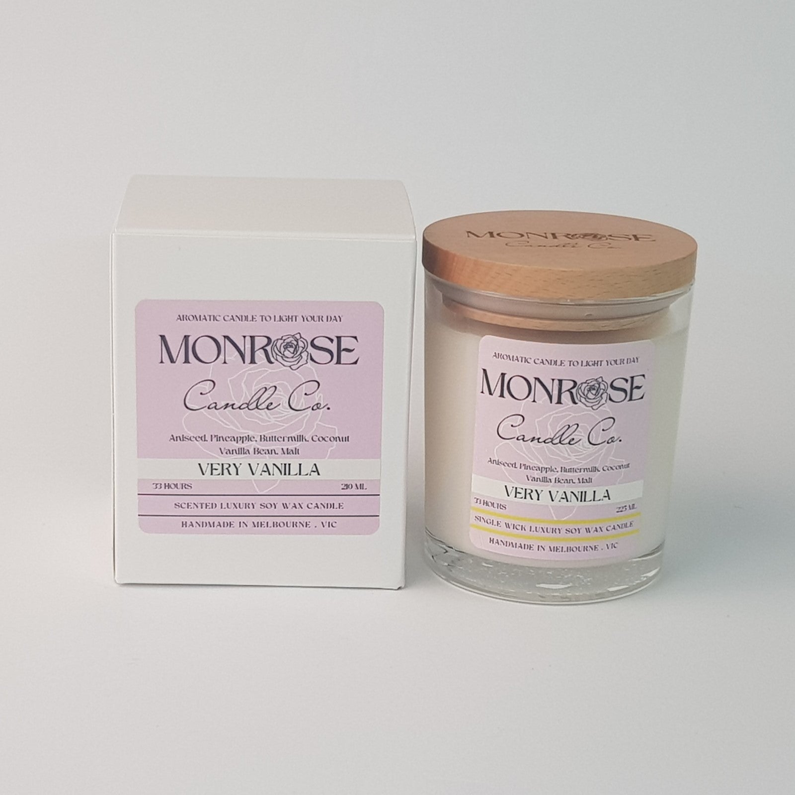 Front view of a clear jar candle with "very vanilla" fragrance and a cotton wick, containing 185 grams of soy wax and offering 33 hours of burn time.