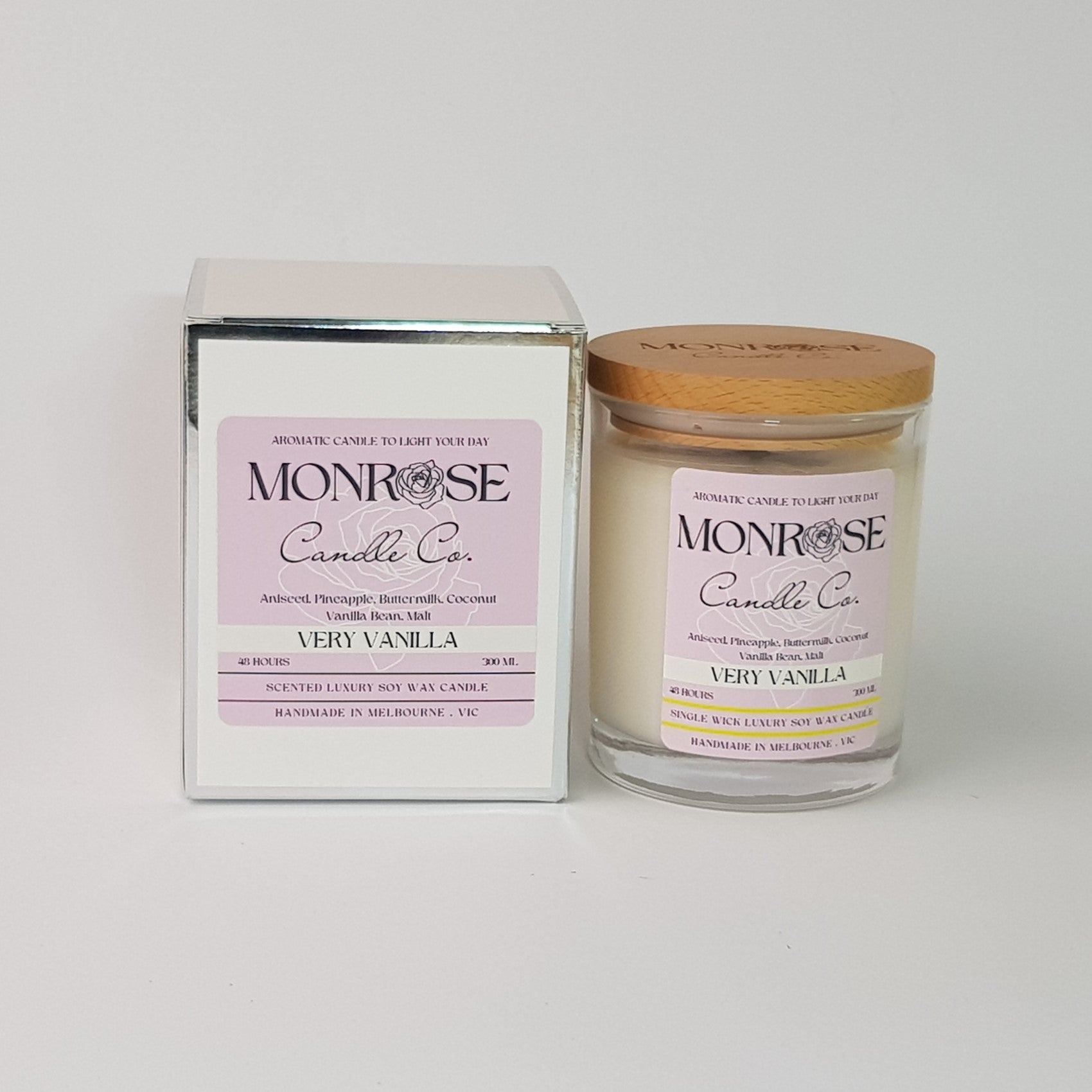Front view of a clear jar candle with "very vanilla" fragrance and a cotton wick, containing 265 grams of soy wax and offering 48 hours of burn time.
