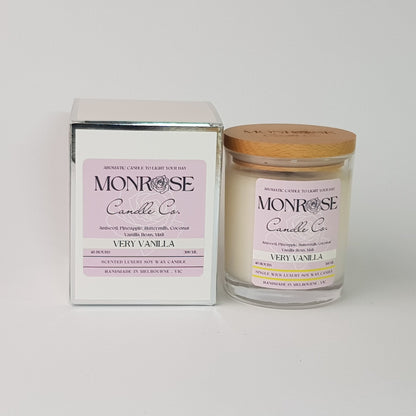 Front view of a clear jar candle with "very vanilla" fragrance and a cotton wick, containing 265 grams of soy wax and offering 48 hours of burn time.