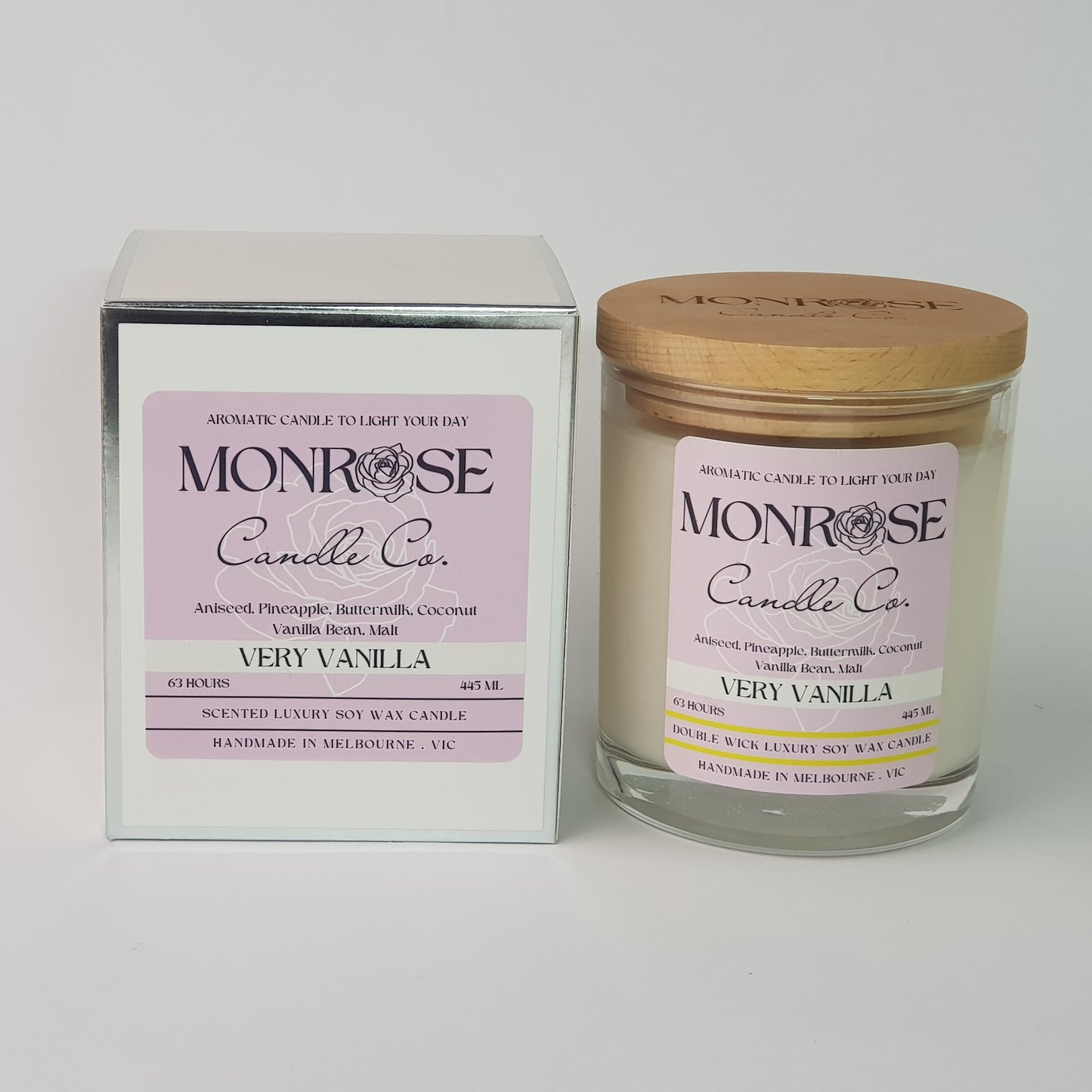 Front view of a clear jar candle with "very vanilla" fragrance and a cotton wick, containing 395 grams of soy wax and offering 63 hours of burn time.