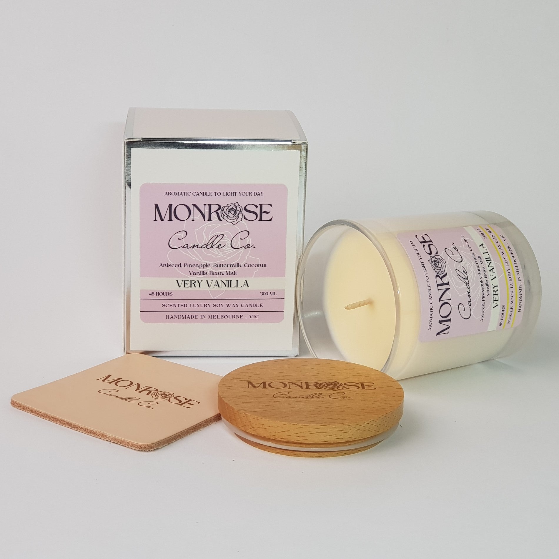 Side view of a clear jar candle with "very vanilla" fragrance and a cotton wick, containing 265 grams of soy wax and offering 48 hours of burn time.