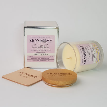 Side view of a clear jar candle with "very vanilla" fragrance and a cotton wick, containing 265 grams of soy wax and offering 48 hours of burn time.